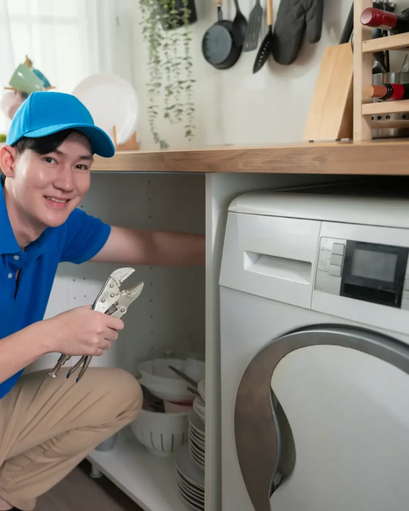 washing machine repair sharjah technician fixing washer